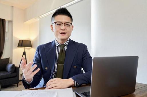 Asian male businessman having a remote meeting Asian male businessman having a remote meeting