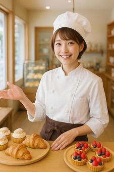 ケーキ屋さんで働く素敵な笑顔の女性 ケーキ屋さんで働く素敵な笑顔の女性の写真