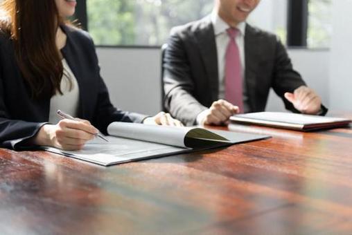 A businessman having a meeting in a bright meeting room A businessman having a meeting in a bright meeting room