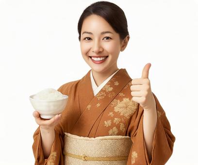 笑顔の和服女性がご飯を手にグッドポーズ 笑顔の和服女性がご飯を手にグッドポーズの写真