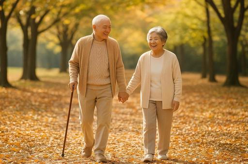 紅葉の中を歩く高齢夫婦 紅葉の中を歩く高齢夫婦の写真