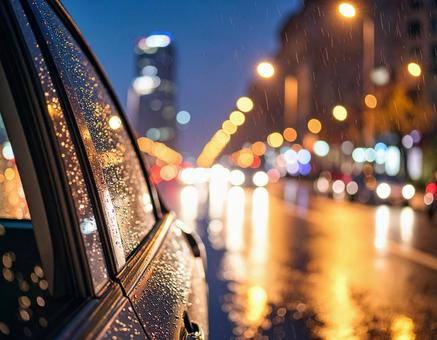 雨に濡れた車と街灯の玉ボケ 雨に濡れた車と街灯の玉ボケの写真