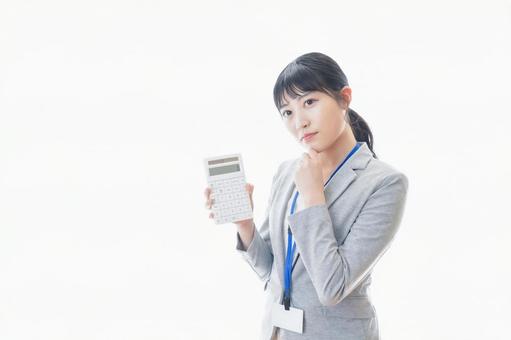 Young business person with a calculator, JPG