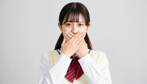 口を手で覆う女子学生 後悔01 口を手で覆う女子学生 後悔01の写真