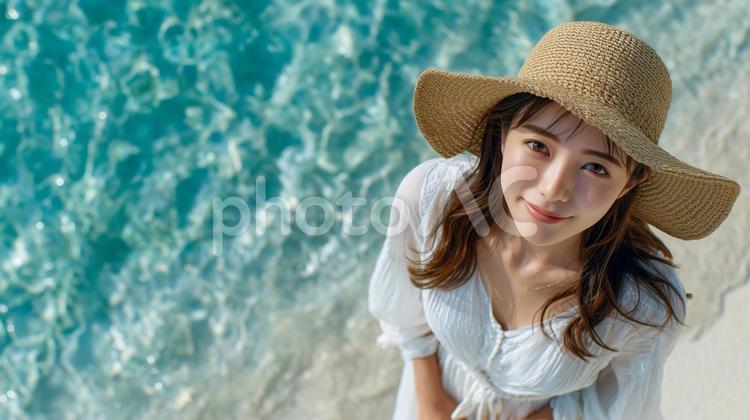 海辺で見上げる女性 ドローン,人物,女性の写真素材