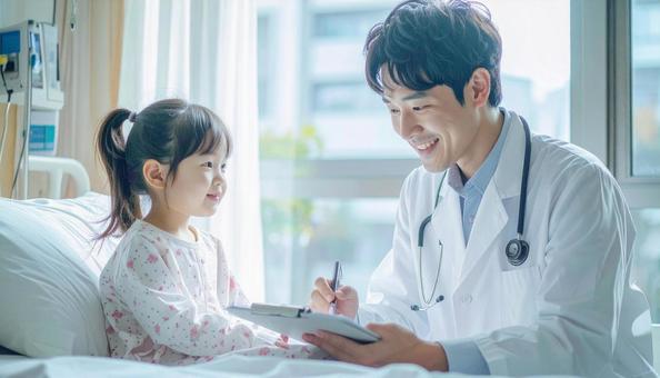 子供の患者と問診する医師の写真