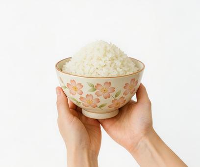 桜模様の茶碗に盛られた新鮮な白米 桜模様の茶碗に盛られた新鮮な白米の写真