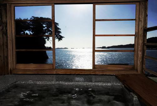 Open-air bath with a view of the sea Open-air bath with a view of the sea