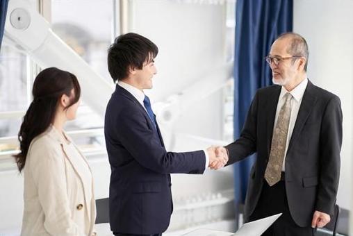 Asian business person shaking hands Asian business person shaking hands