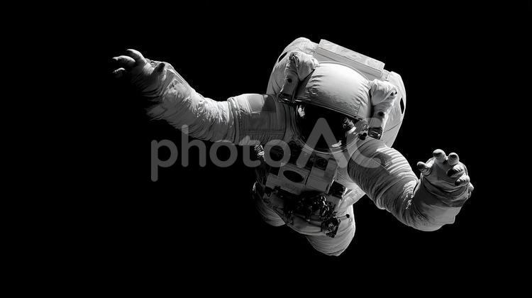 暗闇に包まれた宇宙空間を旅する 宇宙飛行士,宇宙,無重力の写真素材