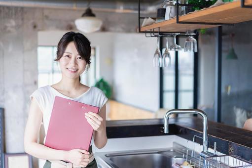 Young female staff working at a cafe, JPG Young female staff working at a cafe, JPG