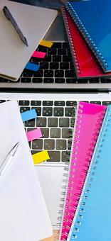 A laptop and a ring notebook with sticky notes, JPG