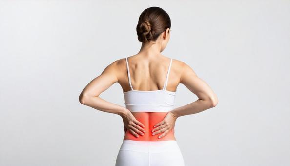 腰痛が辛い女性の写真