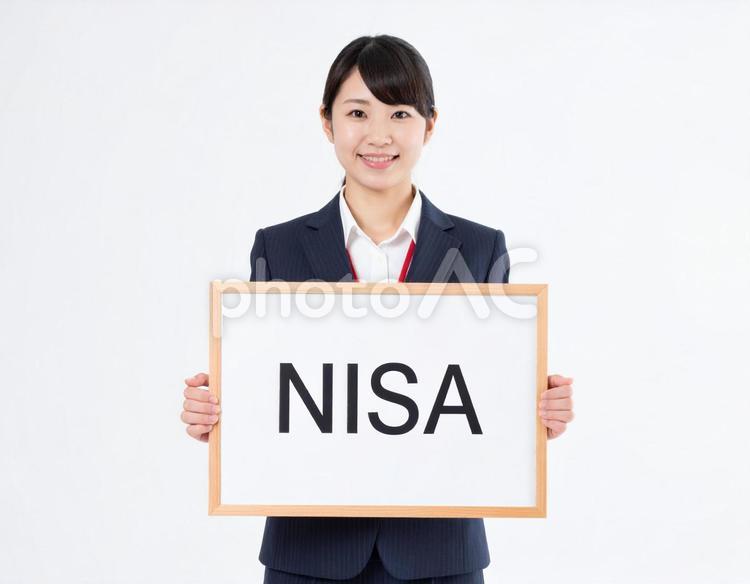 NISAと書いたボードをもつ女性社員 女性,ボード,nisaの写真素材