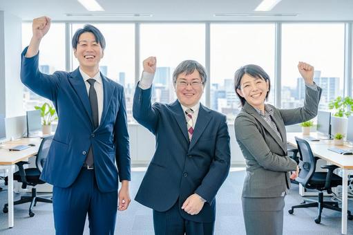 ガッツポーズするビジネスチーム ビジネス,スーツ,チームの写真素材