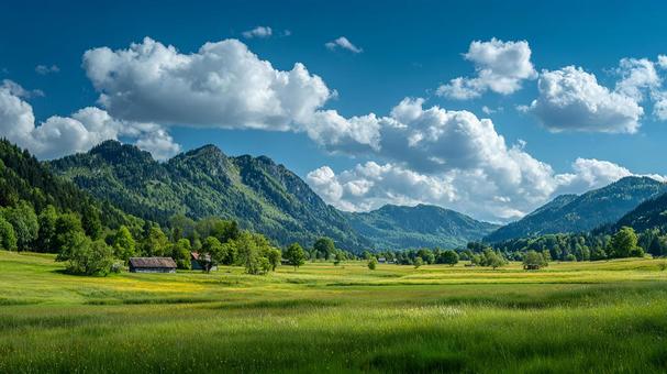 アルプスの丘陵地帯に広がる美しい夏の景観 アルプスの丘陵地帯に広がる美しい夏の景観の写真