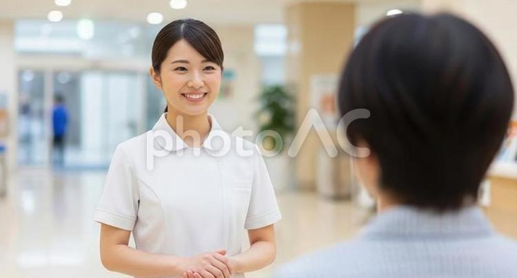 患者に挨拶をするアジア人看護師 看護師,患者,挨拶の写真素材