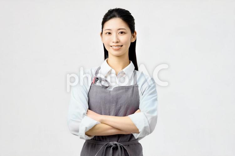 主婦　家事代行　腕組み 主婦,女性,エプロンの写真素材