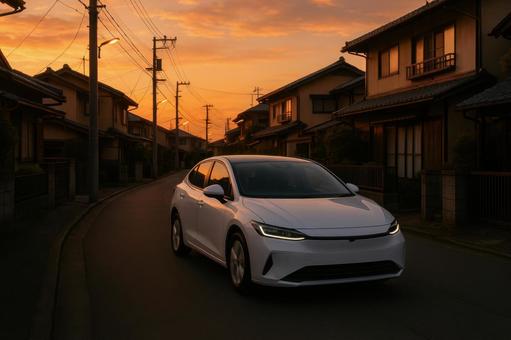 夕暮れの住宅街とEV 夕暮れの住宅街とEVの写真