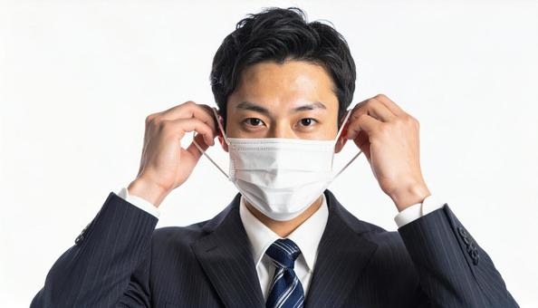 マスクをつける人 マスクをつける人の写真