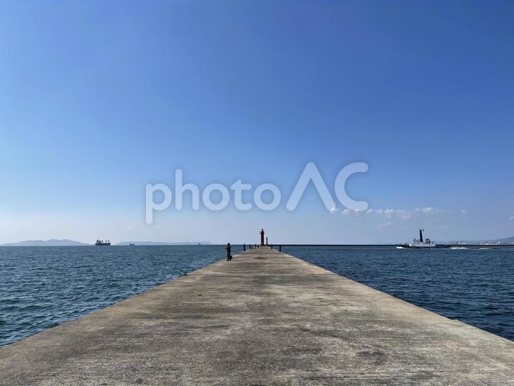青い空と海に伸びる防波堤 海,波,空の写真素材