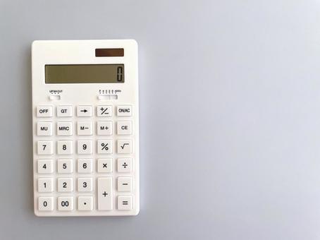 White calculator on a pale blue background, JPG White calculator on a pale blue background, JPG