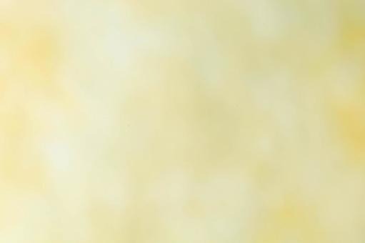 黄色の淡いぼかし背景の写真