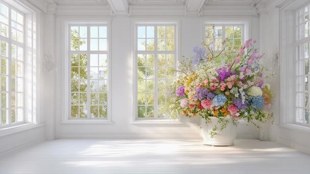 白い窓辺とカラフルな花の写真