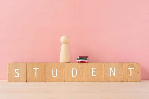Student, Student | Building blocks, humanoid objects and miniature books with "STUDENT" written on them Student, Student | Building blocks, humanoid objects and miniature books with "STUDENT" written on them