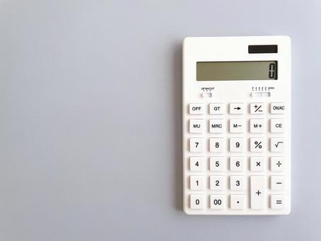 White calculator on a pale blue background, JPG White calculator on a pale blue background, JPG