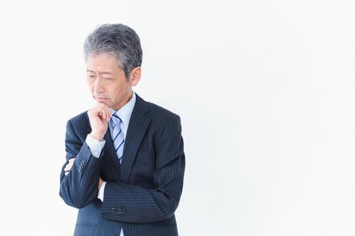 悩む経営者 悩む経営者 白髪,心配,ローンの写真素材