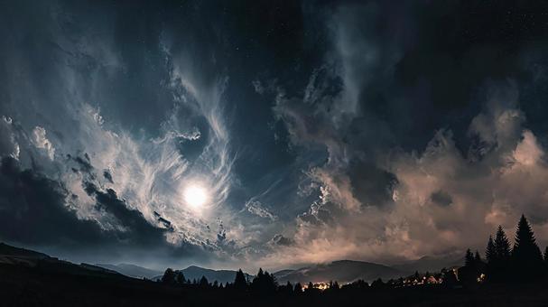 神秘的な光を放つ月と星空 神秘的な光を放つ月と星空の写真