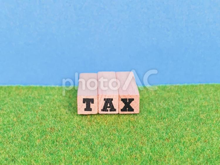 TAXの英文字と背景 tax,税金,関税の写真素材