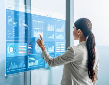 未来を切り拓くAIと向き合う女性の姿の写真