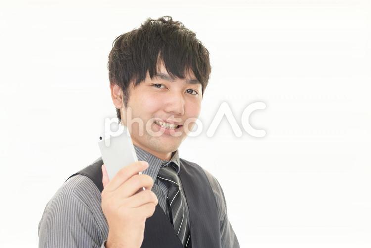 スマートフォンを持つ男性 ビジネス,ビジネスマン,スマホの写真素材