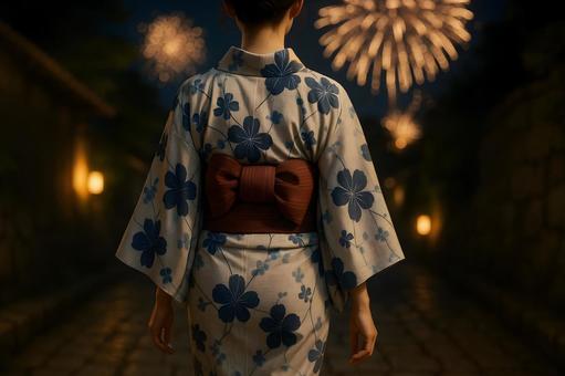 浴衣姿と夜空の花火 浴衣姿と夜空の花火の写真