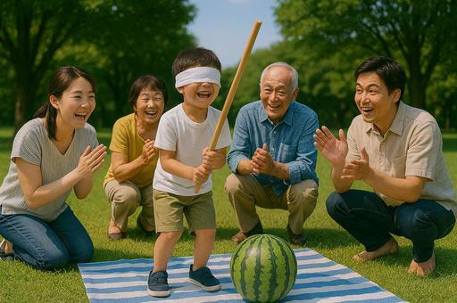 家族で楽しむスイカ割り 家族で楽しむスイカ割りの写真