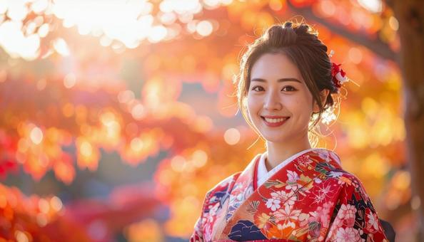 紅葉を眺める晴れ着姿の女性のポートレートの写真