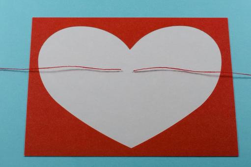 ハートと切れた赤い糸で縁が切れるイメージ 離婚,別れる,喧嘩の写真素材