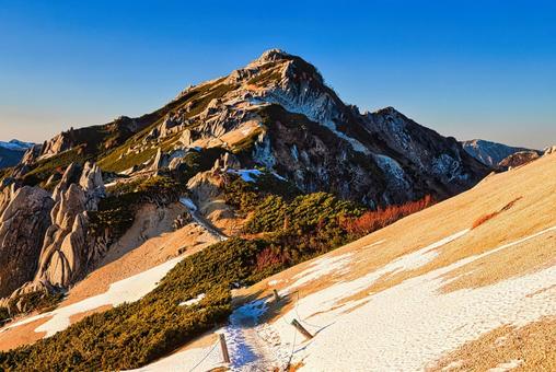 夕焼けの北アルプスの燕岳 夕焼け,アーベントロート,北アルプスの写真素材