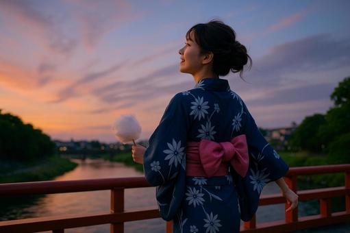 橋の上で立つ浴衣女性 橋の上で立つ浴衣女性の写真
