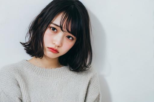 困った顔の女性 困った顔の女性の写真