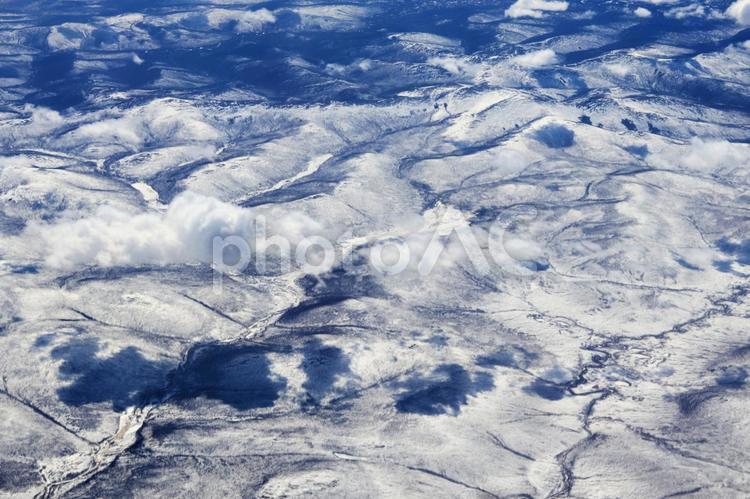 シベリアの山々（機内撮影） 空撮,上空写真,上空の写真素材