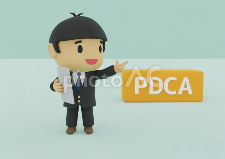PDCAと指差す若い男性ビジネスマン pdcaサイクル,pdca,問題解決の写真素材