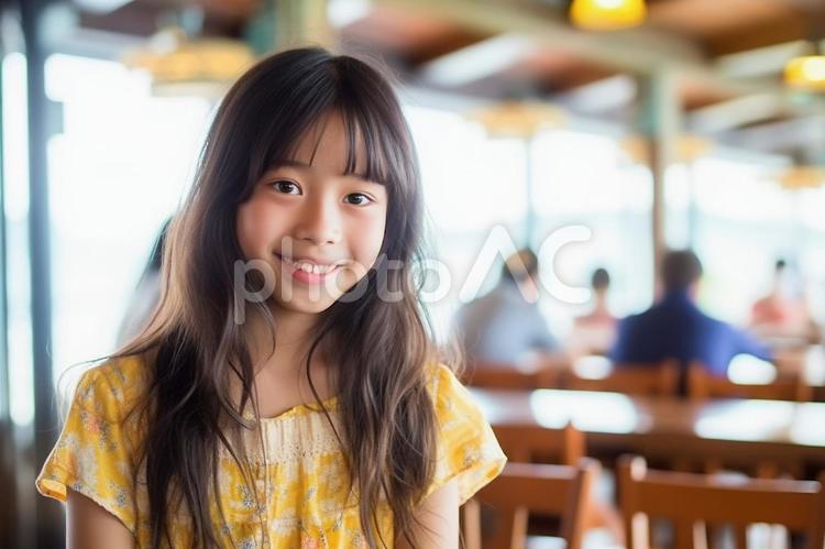 海辺のカフェで休憩中のロングヘアの少女 女の子,少女,中学生の写真素材