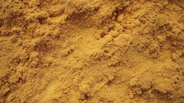 茶色がかった黄色の砂のテクスチャの写真