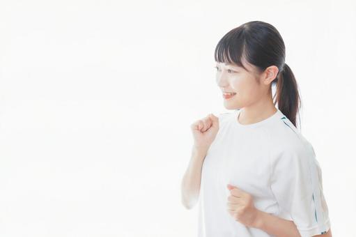体操服でランニングをする若い女性 体操服でランニングをする若い女性 スポーツウェア,授業,体操服の写真素材