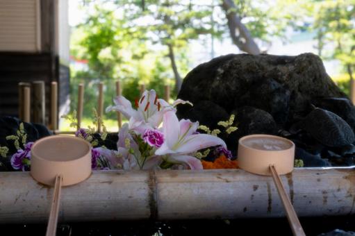 Flower water fountain on a summer day, JPG