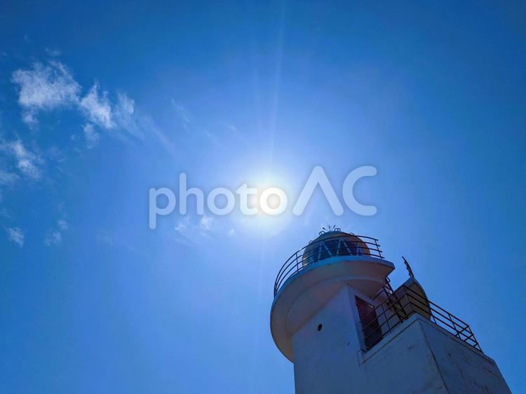 灯台と空と太陽のアート 灯台,太陽,青空の写真素材