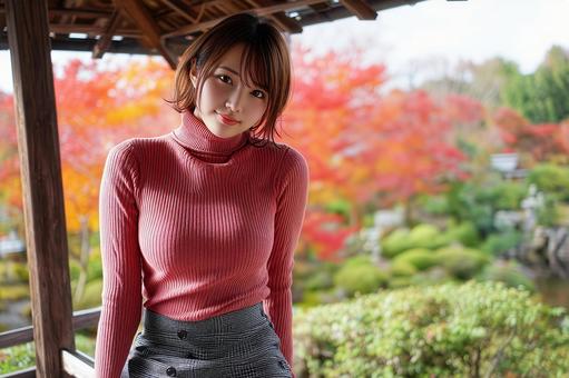 紅葉を楽しむ赤いセーターを着た女性 紅葉を楽しむ赤いセーターを着た女性の写真